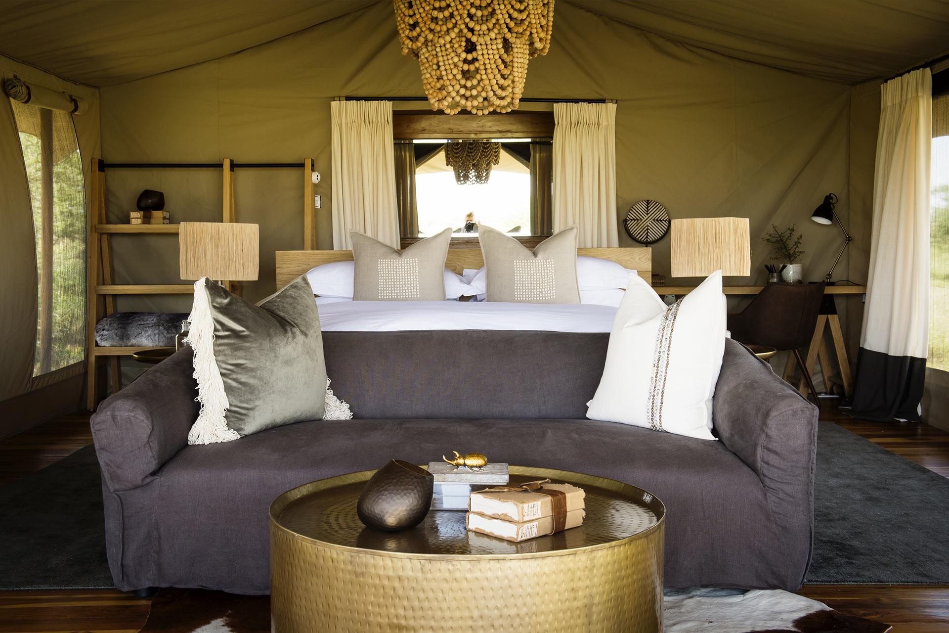 Each tent sits atop a wooden platform raised 30 centimeters from the ground and has a generous sleeping area complete with lounge space. An ensuite bathroom with “his and hers” wash hand basins, large shower and proper flush toilet complete each guest tent